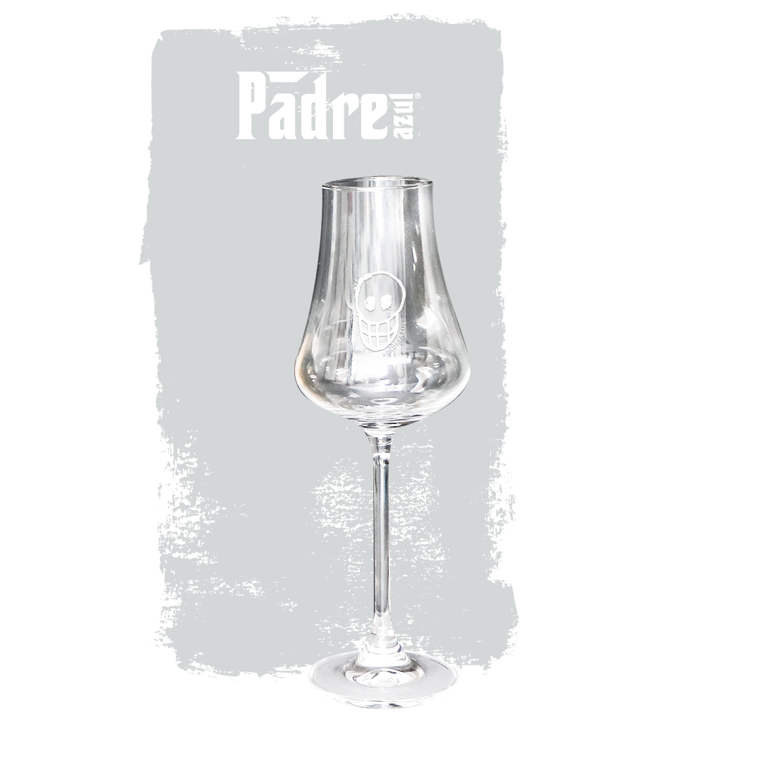 Padre Azul Nosing Glass in front of a grey background.