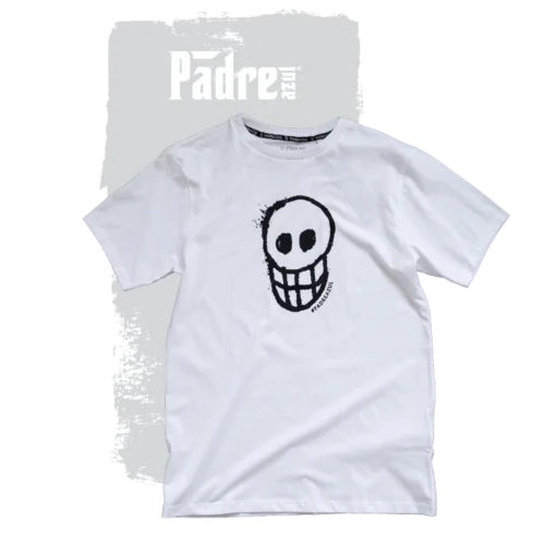 The Padre Azul T-shirt white on a grey background. In the middle of the shirt is a black skull.